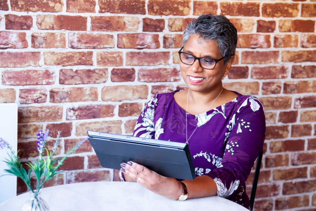 Woman looking at a digital tablet